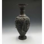 A large Japanese bronze vase, Meiji Period, with figures, birds, flowering branches and pagodas,