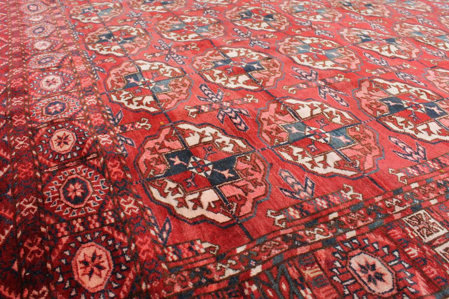 A Tekke carpet, Turkmenistan, circa 1890, the madder field with ten rows of five medallions, - Image 2 of 13