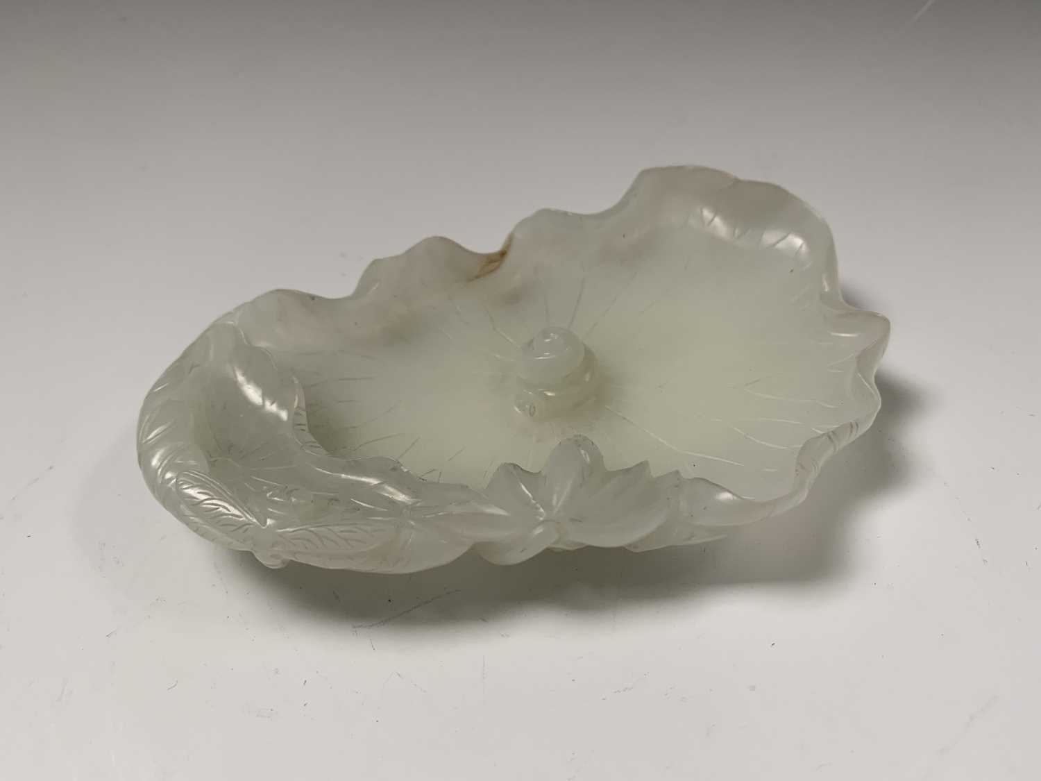 A Chinese white jade 'lotus leaf' brushwasher, 19th Century, height 2.5cm, width 13cm, depth 8.5cm. - Image 5 of 20