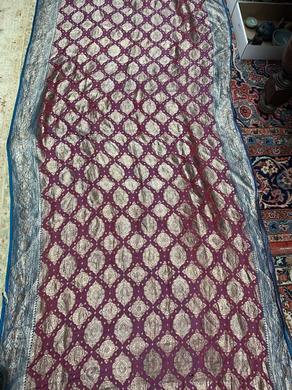 A North Indian sari, the red ground with rows of gold metal thread medallions, 488 x 109cm.Condition - Image 14 of 17