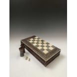 An Anglo-Indian sandalwood games board, 19th century, with ivory and sadeli chess squares within a