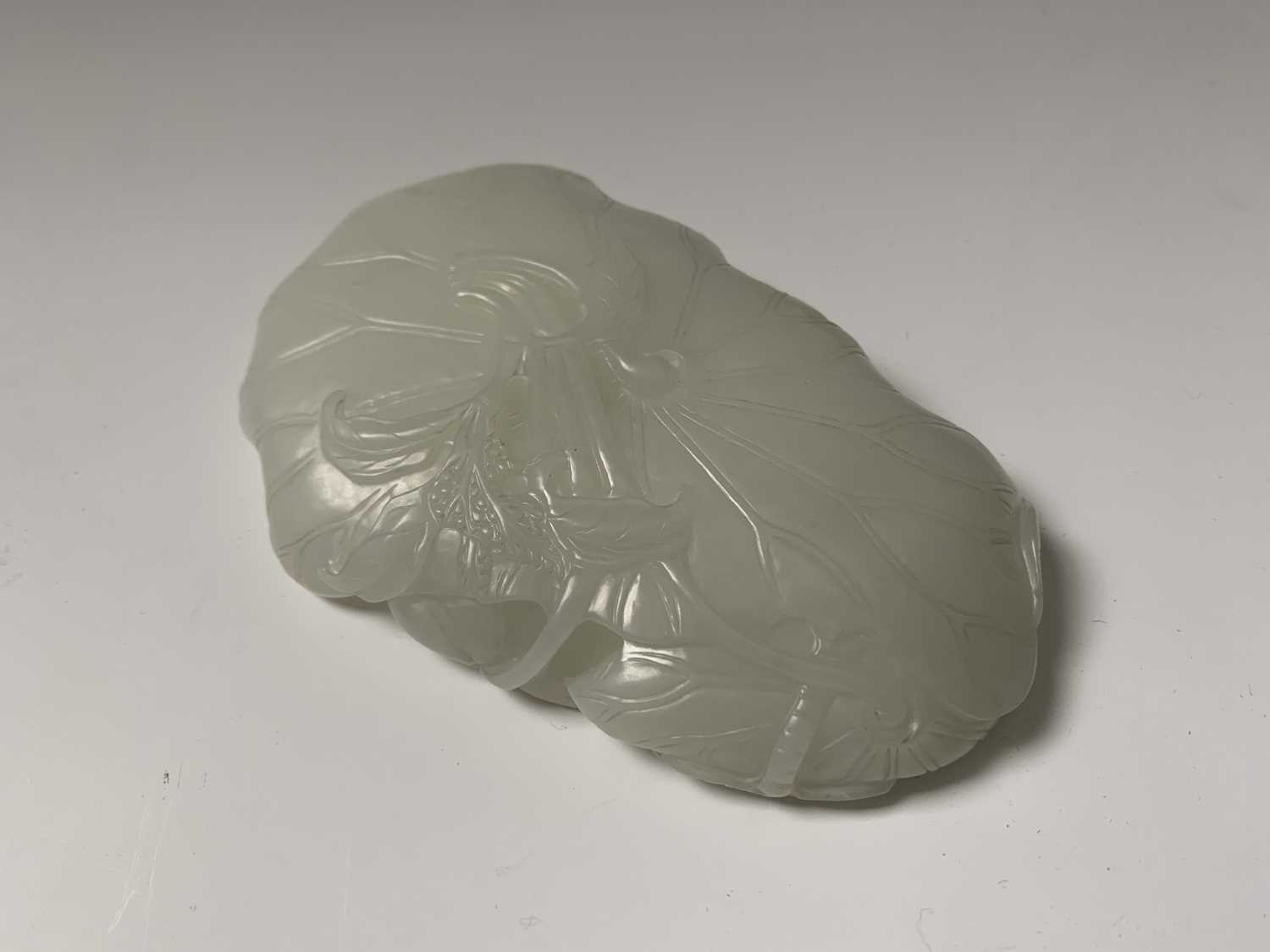 A Chinese white jade 'lotus leaf' brushwasher, 19th Century, height 2.5cm, width 13cm, depth 8.5cm. - Image 6 of 20