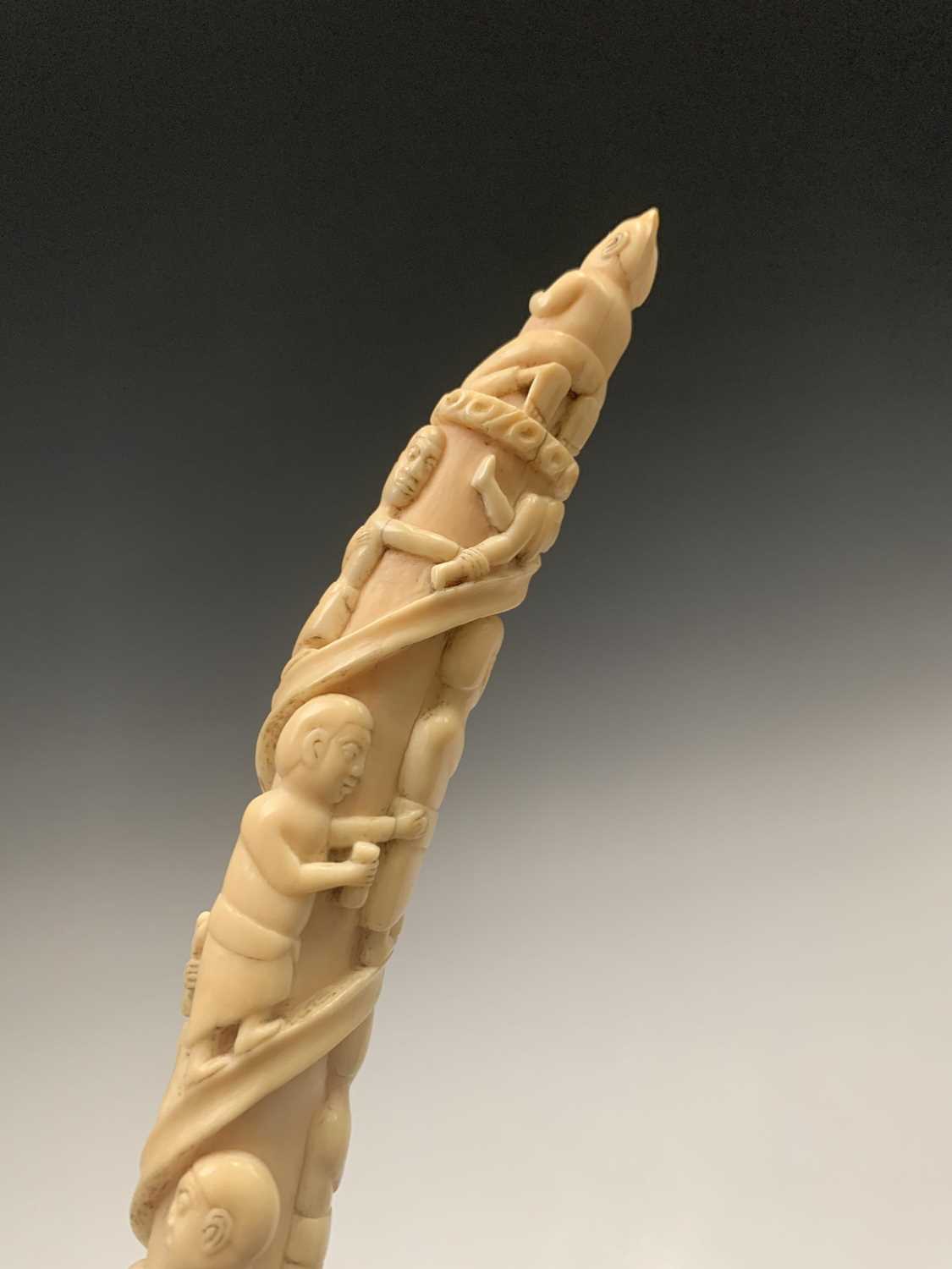 An African Loango ivory tusk, late 19th century, carved with porters some of which are carrying - Image 3 of 10