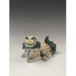 A Japanese porcelain shishi or lion dog, late 19th century, height 12cm, width 20cm.