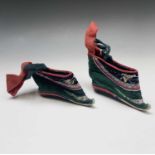 A pair of Chinese silk embroidered lotus shoes, early 20th century, length 13.5cm.