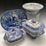 An 1820s, earthenware blue and white meat plate 43x32.5cm depicting waterside ruins and figures with