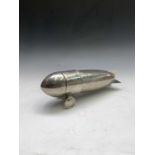 An Art Deco style cocktail shaker in the form of an aeroplane. Length 32cm.