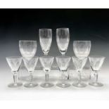 A pair of Waterford 'Colleen' pattern champagne flutes, another pair of glasses in the same pattern,