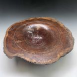 A well figured jarrah wood tunrned bowl, of rustic shaped form, maximum width 60cm. Turners monogram