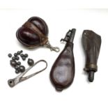 A 19th century leather Shot flask, 20.5cm, a powder flask, a bullet mould, a small leather shot