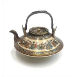 A Japanese Satsuma teapot, Meiji Period, painted with flowerheads and rectangular panels enclosing