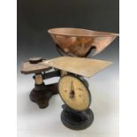 A set of iron large grocer's weighing scales, with shaped copper pan, height 42cm, with two