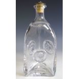 A 1950s Erik Hoglund for Kosta Boda (Sweden) clear glass decanter of triangular form with mask