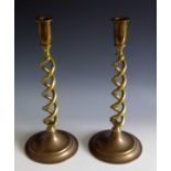 A pair of brass candlesticks with twisted stems. Height 31cm.