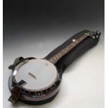 A Stagg five string Banjo, in soft case length 96cm. Condition report: This modern instrument is