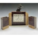 An Art Deco French marble three piece clock set, mounted with a gazelle, height of clock 29cm.