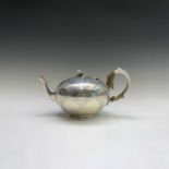 A Victorian silver teapot by Daniel & Charles Houle with engraved decoration and melon finial London