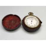 A late 19th century gilt pocket barometer, cased, diameter 5cm. Provenance: From Penrose House,