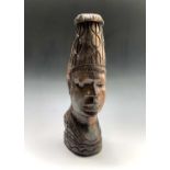 An African carved wood head. Height 36.5cm.