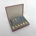 A set of six Egon Lauridsen Danish silver enameled and gilt coffee spoons, cased