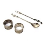 A pair of Indian silver napkin rings and a pair of Asian silver servers 120gm