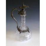 A Victorian glass claret jug with ornate EPBM mounts. Height 30cm.