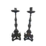 A pair of early 18th century style ebonised and silver candlesticks. Height 51cm, diameter 15cm at