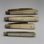 Four fruit knives, each with mother-of-pearl covers and plain folding silver blade
