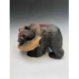 A carved wood bear with a salmon in its mouth 37cm