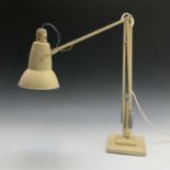 A Herbert Terry Anglepoise lamp, cream finish, on a stepped base, maximum height 89cm.