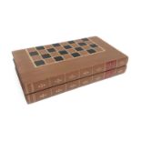 A Leather bound folding chess board, as two volumes, 'History of America', length 45cm.