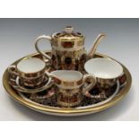 A Royal Crown Derby miniature tea-for-one set comprising tea pot, milk jug, sugar bowl, and cup