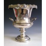 A silver plated champagne cooler of campana urn form, the rim modelled with fruiting vines, with