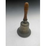 A late Victorian brass hand bell with turned ash handle. Height 31cm.