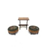 A pair of Victorian circular mahogany footstools, with embroidered tops on turned legs, diameter