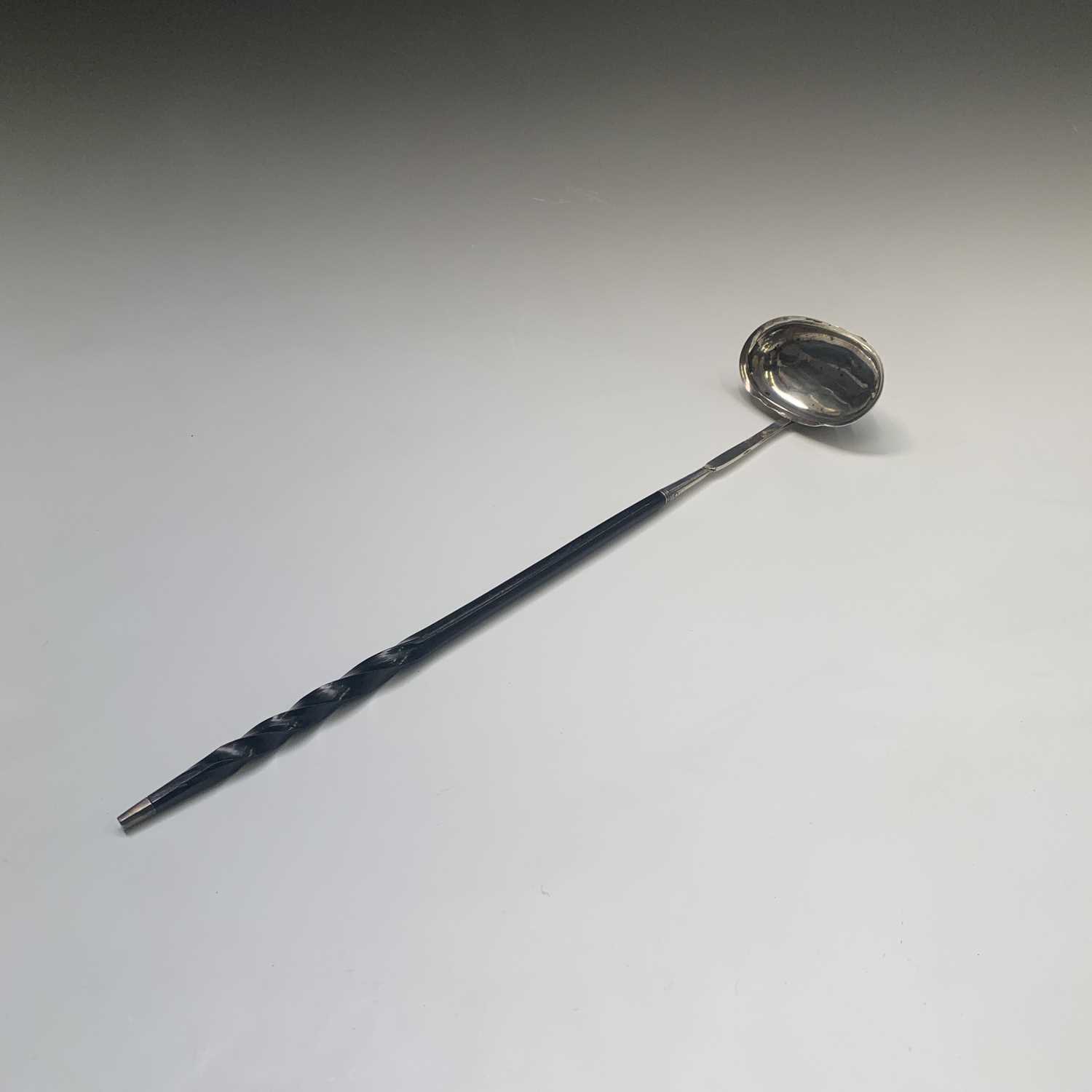 A George III silver punch ladle by Elizabeth Morley the plain oval bowl with silver tipped spiral - Image 2 of 3