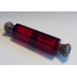 A late 19th/early 20th century double ended faceted ruby glass perfume bottle with hinged white