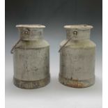 A pair of small alumium milk churns. Height 28cm. Provenance: From Penrose House, the Penrose