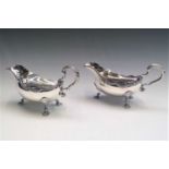 A pair of handsome silver sauce boats with gadrooned borders and shell feet in George II style