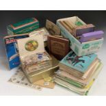 Stamps: Very large accumulation of all world stamps sorted into envelopes, tins and juvenile albums.