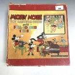 Mickey Mouse toy lantern outfit, with quantity of glass coloured slides, in original box.