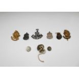 MILITARY BADGES & BUTTONS: Includes 2 x Artists Rifles cap badges, a T28 London shoulder title,