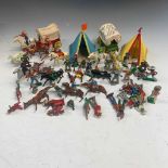 Lead toys: A quantity of lead Cowboys and Indians including 2 horse drawn covered wagons and tents