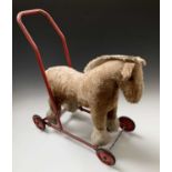 A mid century child's push along horse.Height 63cm.