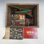 Meccano: A quantity of Meccano in a wooden box.