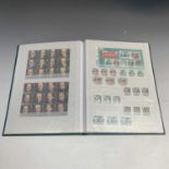 Great Britain: A quantity of recent unmounted mint GB stamps contained in a green WHS stockbook.