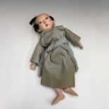 JAPANESE DOLL: A porcelain headed Japanese doll dressed in a grey gown - some hair loss.