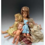 DOLLS: A bag contaiing 12 dolls of varying sizes and age including celluloid, cloth and plastic.