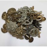 CAP BADGES. A bag containing 28 British military cap badges, most appear genuine.