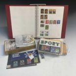 A Great Britain mint and used stamp album, together with a bag of G.B. presentation packs and F.D.